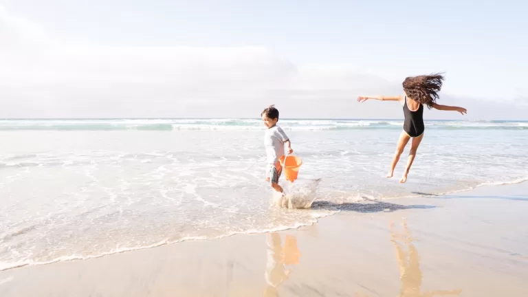 Two children playing on a beach