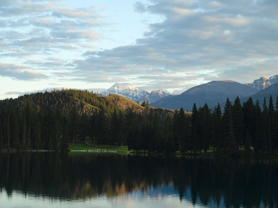 Jasper National Park mountains with a lake in the foreground.
